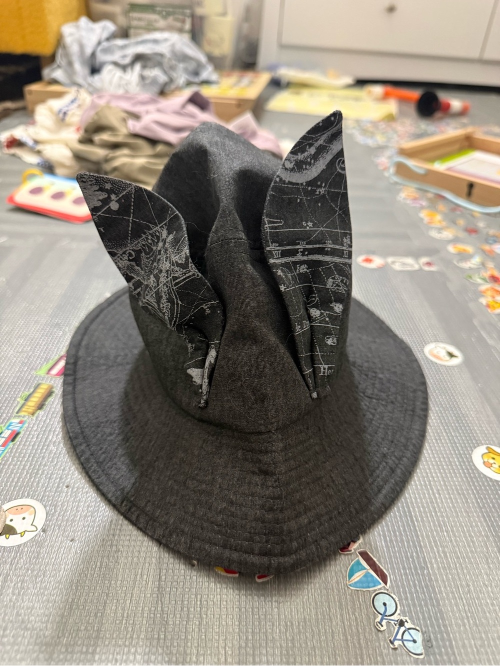 Elfinfolk kids Black bucket hat with bunny ears and map pattern